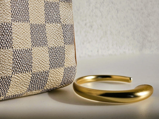 Taschenhalter für den Tisch goldfarben